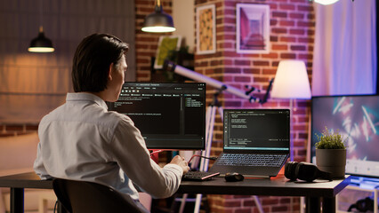 Male coder programming server encryption on firewall software, using security network to code...