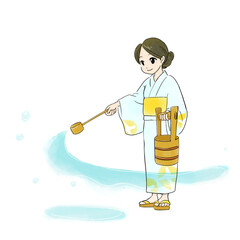 打ち水をする浴衣姿の女性