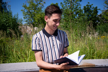 Education and entertainment. Young attractive student with a book. 