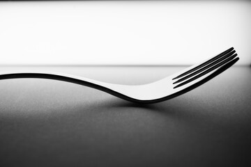 fork and knife on black background