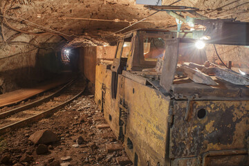 Fototapeta na wymiar Old rusty train in iron ore mine.