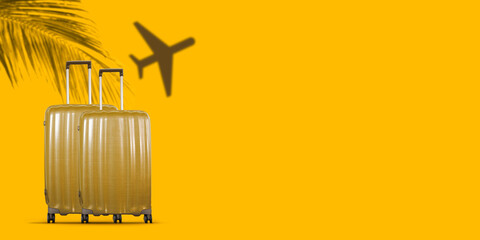 Tropical travel concept with suitcases on yellow background.