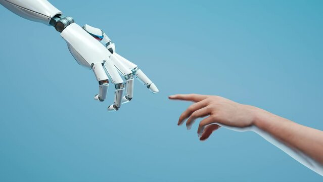 Robotic arm touching human hand. Unity of biology and the digital world.