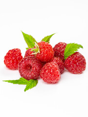 Ripe raspberries with leaves isolated on white background