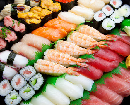 Japanese Sushi arranged on a traditional sushi tray.

