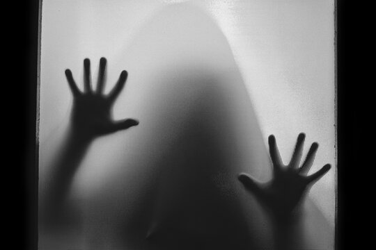 Shadowy figure behind glass - creepy, horror background