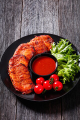 roast slices of pork loin with lettuce and tomato