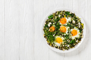 green shakshuka on white plate, top view