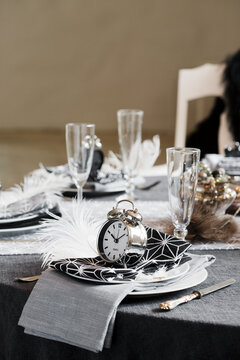 Place setting with alarm clocks on dining table