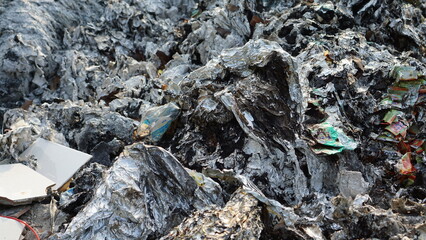 A pile of garbage. Toxic plastic into nature. Environmental pollution. Ecological issue.