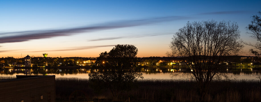 City and river at sunset