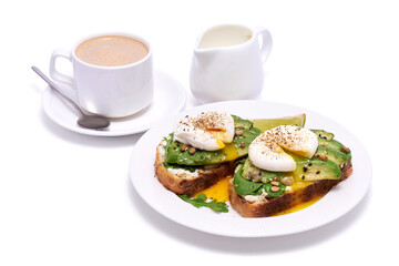 Freshly made poached egg and Avocado toasts isolated on white background