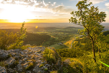 Dramatic sunset over scenic rock ledge in the Swabian Jura in Southern Germany