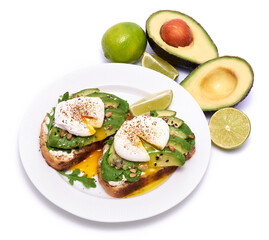 Freshly made poached egg and Avocado toasts isolated on white background