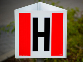 Sign pointing to a fire hydrant outside.