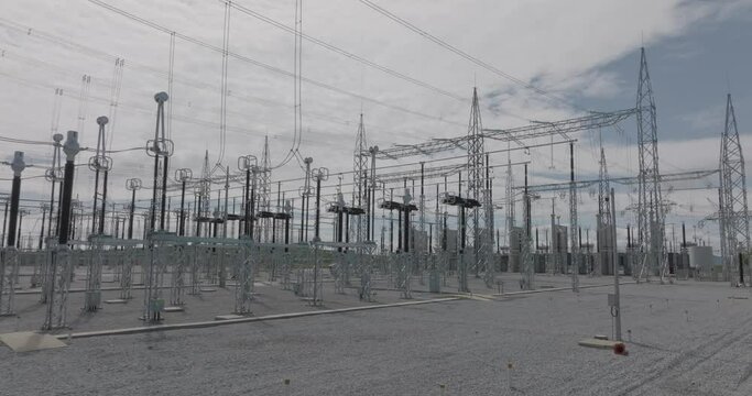 Scene Of Voltage Power Lines Substation. Low Aerial Flying