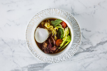 Soup with mozzarella, meat