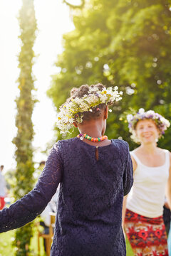 Girl and her mother in flower crowns
