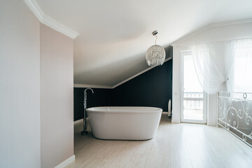 White bathroom in modern house stands in master bedroom.