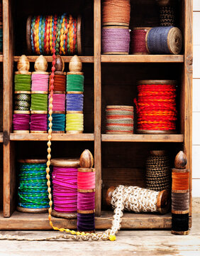 Spools of thread and ribbon on shelves