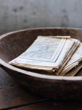 Maps in wooden bowl