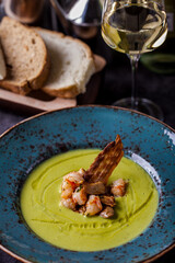 Soup with pumpkin, shrimp, meat and bacon