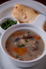 Soup with parsley, meat, carrots
