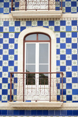 detail of a panel of azulejos tiles on the facade of an old house in Leiria, Portugal