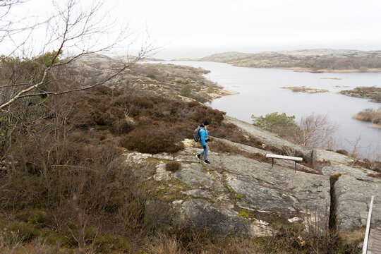 Woman walking on rocks
