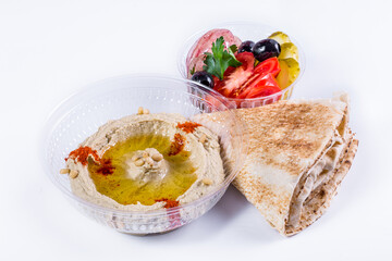 Hummus with pita bread and salad.