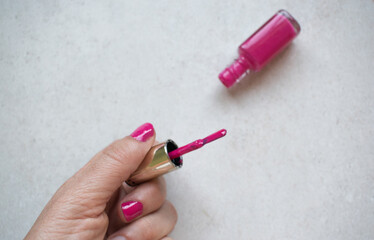 pink nail polish on white
