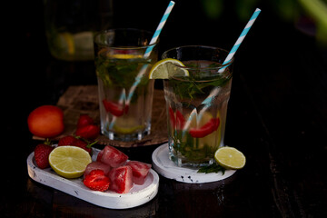 Infused, vitaminized, detox healthy drinks. Natural homemade summer cocktails with strawberry ice,...