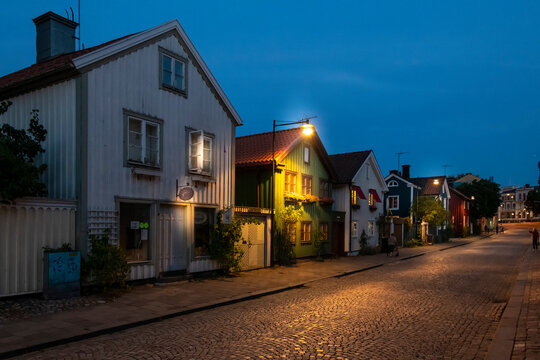 Houses on street at night