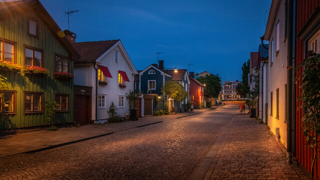 Houses on street at night
