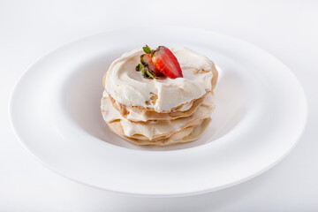 Pancakes with white cream and strawberries