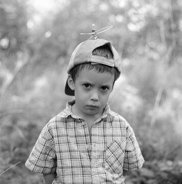 Portrait of boy in propeller hat