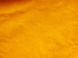 Yellow old velvet fabric texture used as background. Empty golden fabric background of soft and smooth textile material. There is space for text..