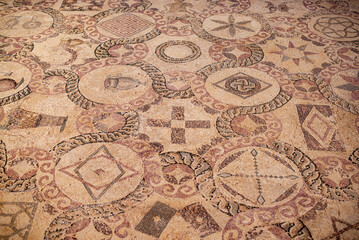 Ancient Greek floor mosaic in archaeologic park Kato Paphos, Cyprus.