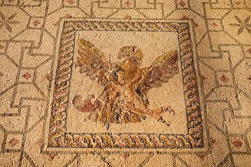 Fototapeta na wymiar Ancient Greek floor mosaic in archaeologic park Kato Paphos, Cyprus.