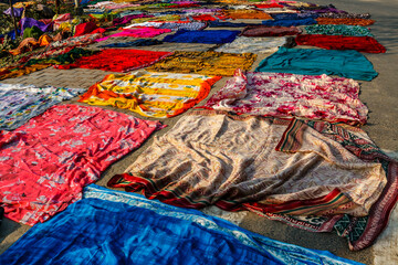 Colorful cloths dry in the sun along the Yamuna river in Agra, Uttar Pradesh, India, Asia