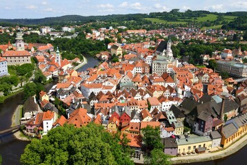 Fototapeta na wymiar Panorama Cesky Krumlov. A beautiful and colorful amazing historical Czech town. The city is UNESCO World Heritage Site on Vltava river. Aerial view from drone. Czech, Krumlov