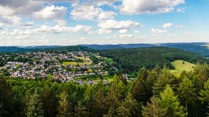 Fototapeta na wymiar Panoramic view of the hilly landscape near Wilhelmsfeld, in Baden-Württemberg. Green nature with mountains and forests. 