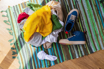 top view, close-up, a pile of dirty things on the floor in the sun, in the morning