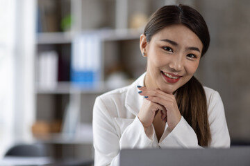 Business of Asian woman or accountant working on calculator to calculate business data, accounting...