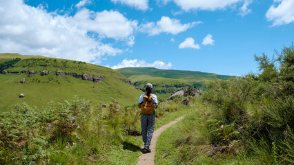 Young woman hiking in the mountains, .Drakensberg Giant Castle South Africa,Drakensberg mountain...