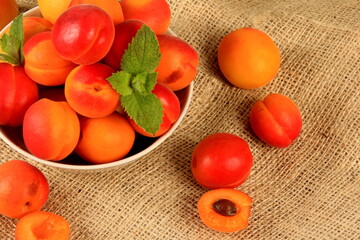 fresh apricots on old burlap background