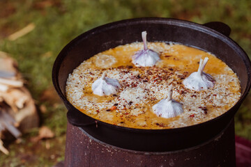 Recipe for traditional oriental pilaf in a cauldron in nature. Cooking. Recipes. Step-by-step photo instructions for cooking pilaf. 