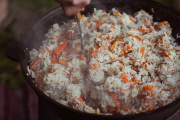 Recipe for traditional oriental pilaf in a cauldron in nature. Cooking. Recipes. Step-by-step photo instructions for cooking pilaf. 