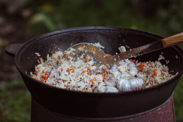 Recipe for traditional oriental pilaf in a cauldron in nature. Cooking. Recipes. Step-by-step photo instructions for cooking pilaf. 