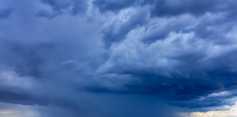 Light in the Dark and Dramatic Storm Clouds background